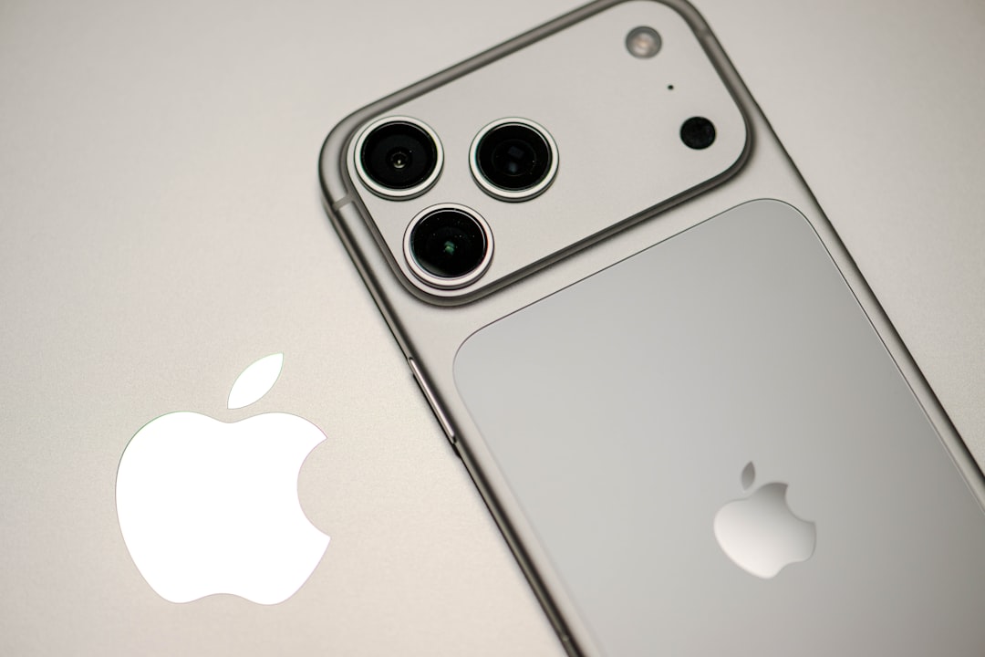 Close-up of a silver iPhone with apple logo.