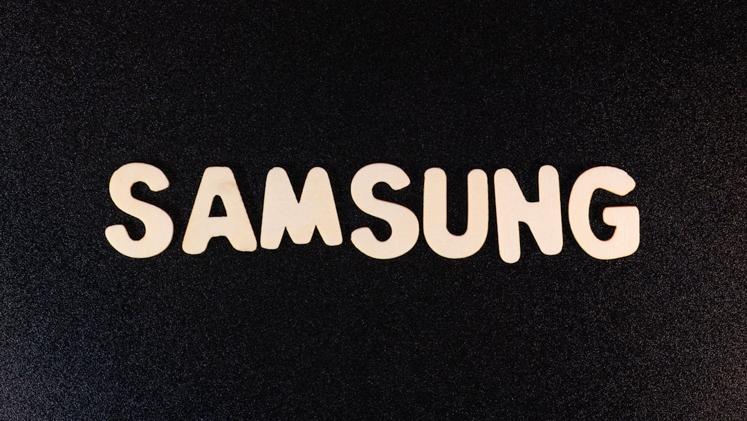 a close up of a samsung logo on a black surface