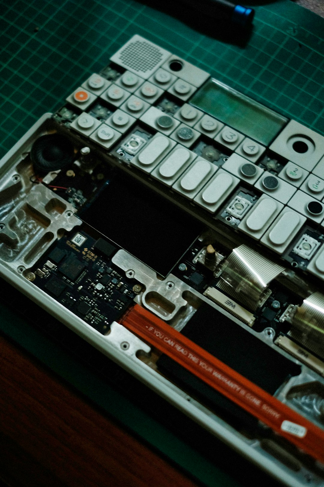 An electronic device is being disassembled.