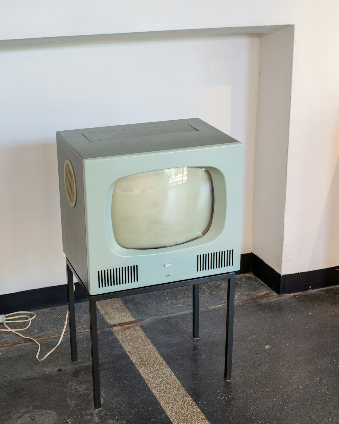Vintage television set on a metal stand