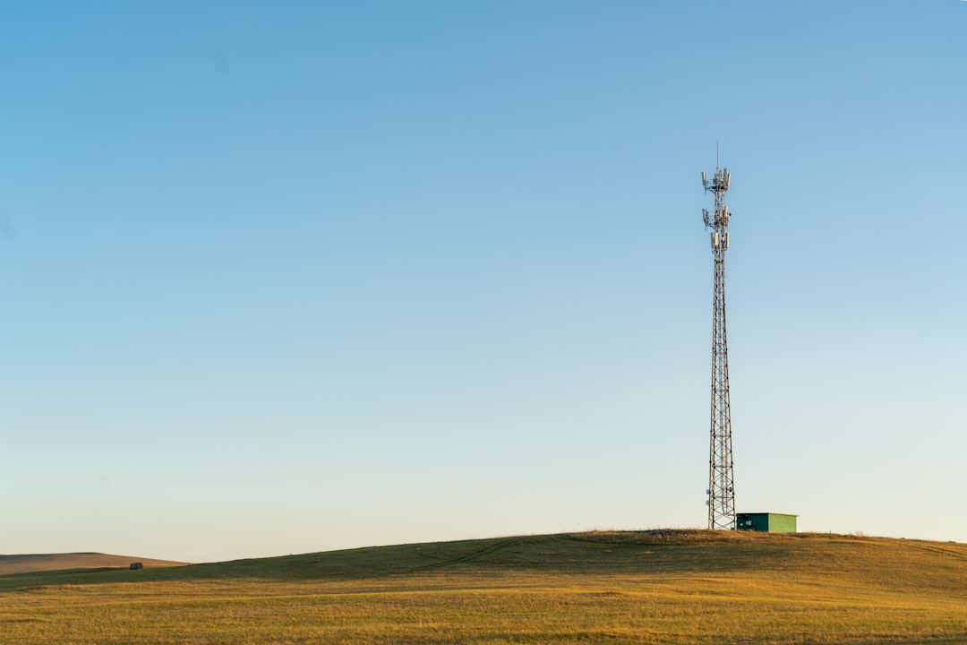 A radio tower on top of a hill