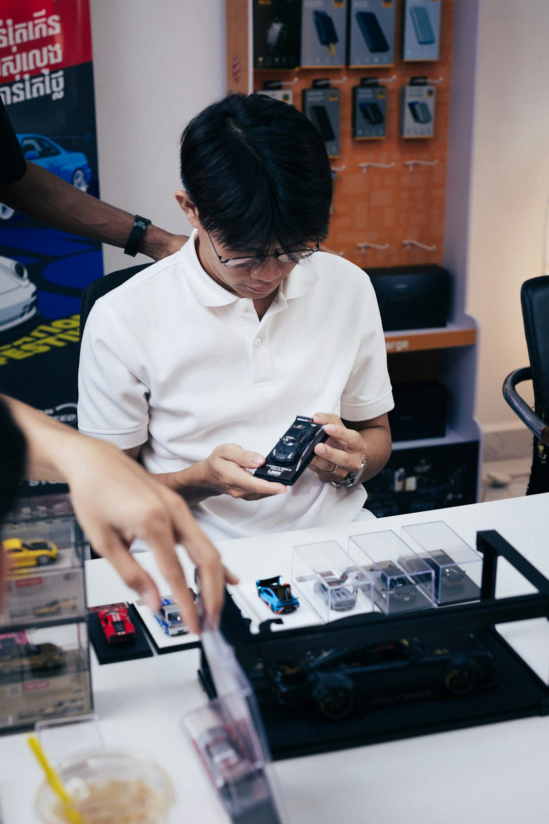 Young man examining a small electronic device