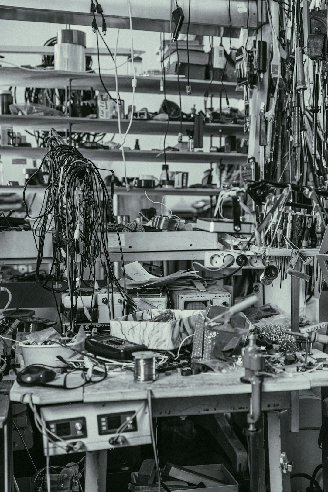 A black and white photo of a room full of wires
