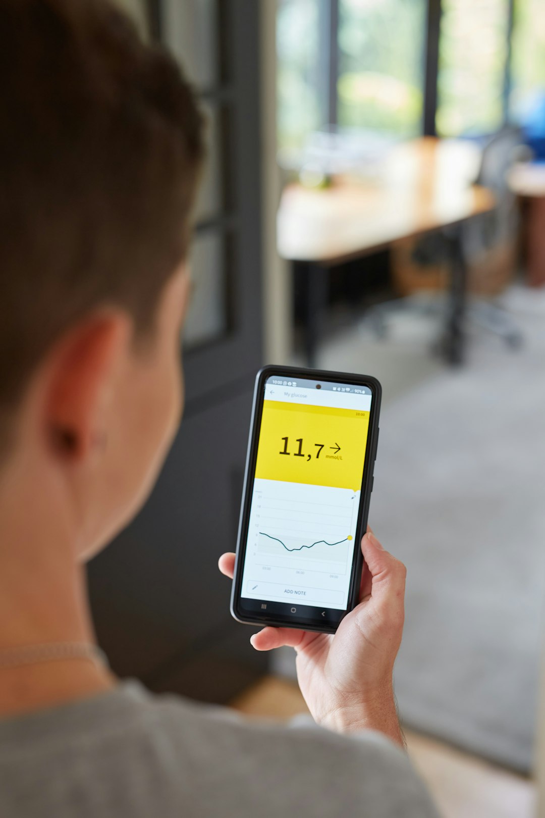 Person checks a reading on their smartphone