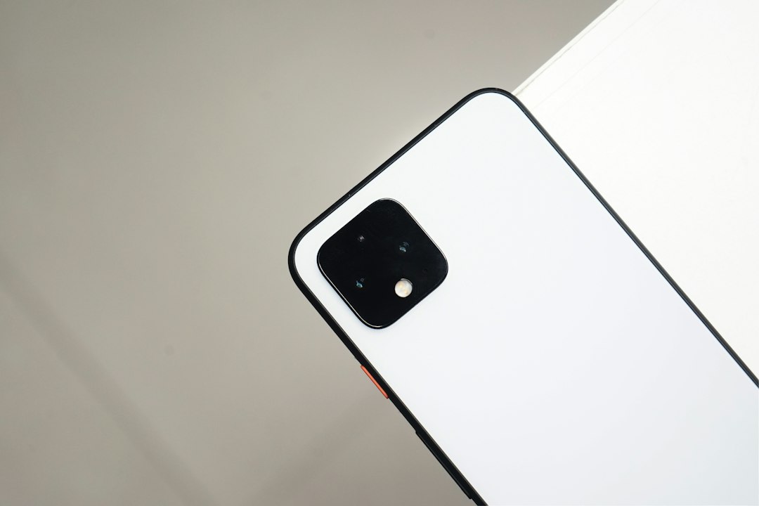 white iphone 4 on white table
